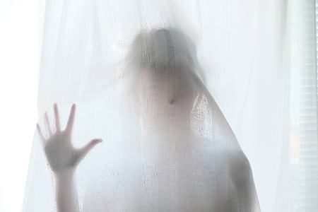 woman behind white textile thumbnail