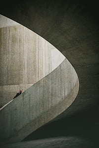 man walking on gray concrete pathway thumbnail