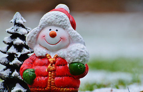 selective focus photography of snowman wears red hoodie jacket figurine thumbnail
