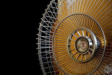 Close-up Photography of Gray Stainless Steel Fan Turned on Surrounded by Dark  Background thumbnail