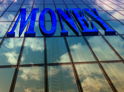 architectural photography of clear glass high-rise building with Money signage thumbnail