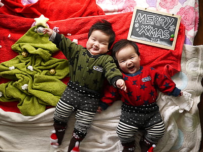 two babies looking at camera while smiling thumbnail