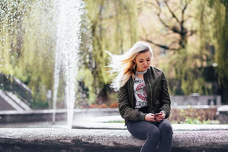woman sitting near to fountain thumbnail