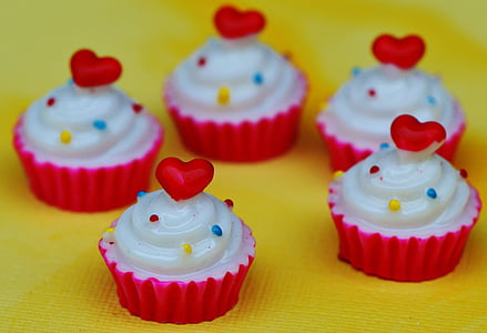 five cupcakes on yellow surface thumbnail