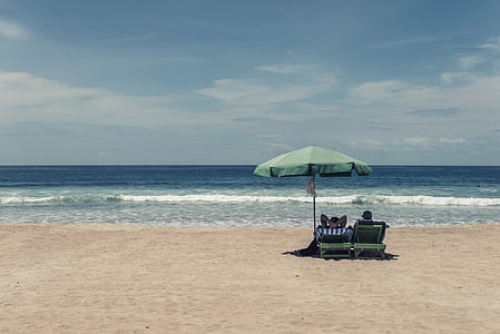 two people resting by the beach thumbnail