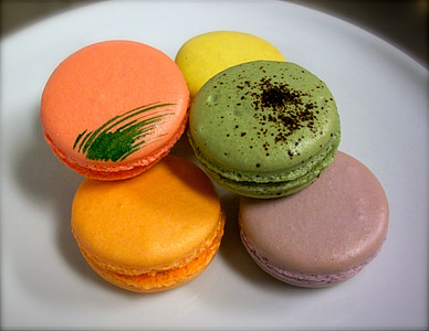 assorted-color macaroons on white plate thumbnail