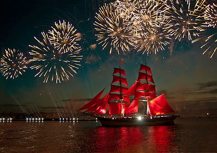 red and beige ship under fireworks landscape photograph thumbnail