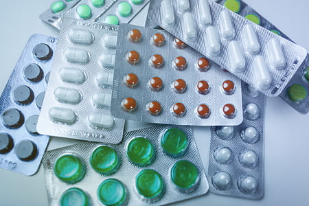 Medicine pills in packs on the table. Full screen background thumbnail