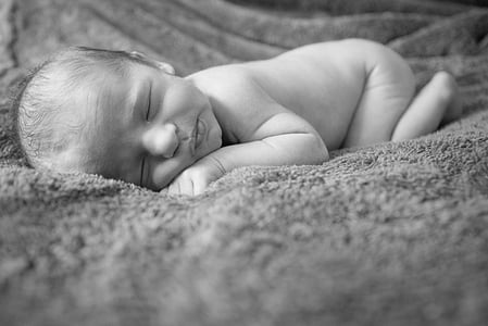 baby sleeping in grayscale photo thumbnail