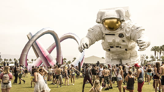 people standing in front astronaut balloon thumbnail