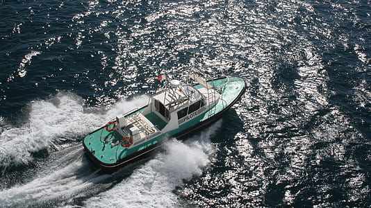white and green speed boat of body of water thumbnail