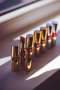 red lipsticks standing beside window thumbnail