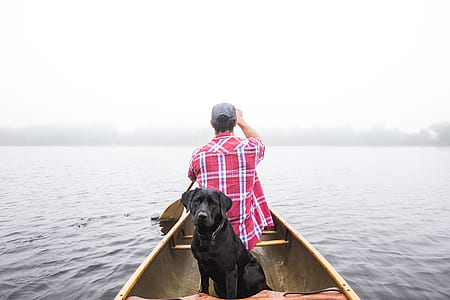 man wearing red and white plaid sport shirt riding boat thumbnail