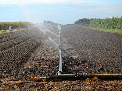black metal water pipe spraying the field thumbnail