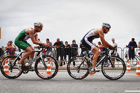 two male cyclists on roadway thumbnail