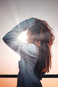 woman touching her hair thumbnail