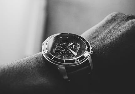 grayscape photography of person wearing chronograph watch thumbnail