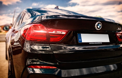 selective focus photo of black BMW coupe thumbnail
