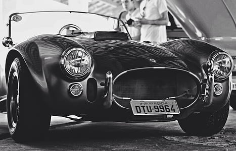 grayscale photography of classic vehicle thumbnail