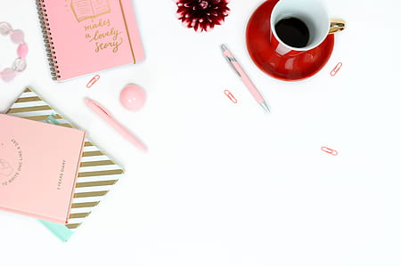 red teacup and pink note books thumbnail