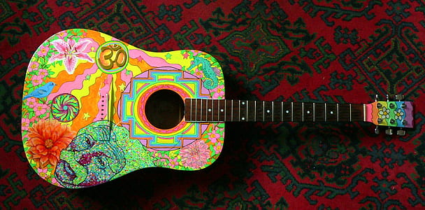 black and multicolored dreadnought acoustic guitar on textile thumbnail