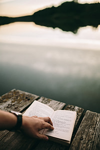 Reading book at lake thumbnail