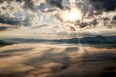sun shining through clouds thumbnail