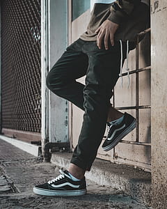 man leaning on wall thumbnail