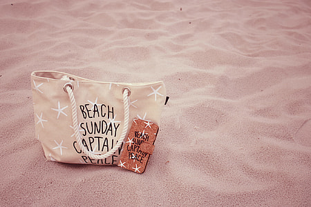 Beach Sunday Captain Peace printed brown leather tote bag on sand thumbnail