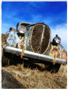 low angle photography of silver car thumbnail