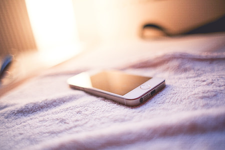 iPhone 5S Gold in a Bed thumbnail
