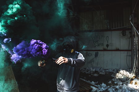 person using purple and green smoke bomb thumbnail