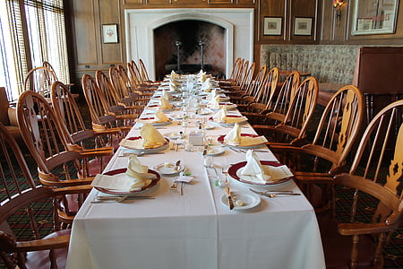 dinnerware on white table with chairs inside room thumbnail
