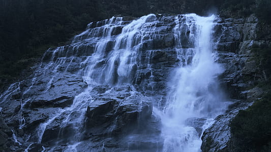 water rushing on grey rock formation thumbnail