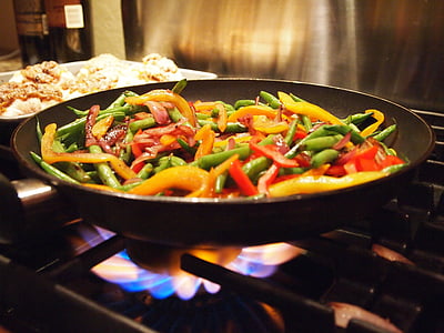stir-fried vegetables on cast iron wok thumbnail
