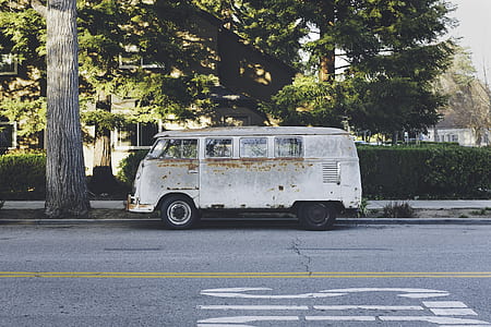 white van beside green tree thumbnail