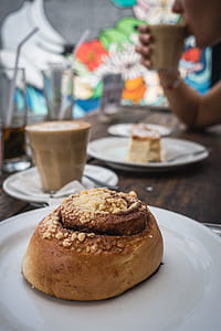 Cinnamon roll with coffee in a coffeeshop thumbnail