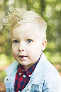 selective focus photography of boy face thumbnail