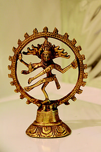 close-up photo of gold-colored Shiva Nataraja figurine thumbnail