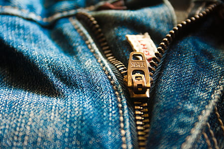 selective focus photography of half-opened ragged zipper thumbnail