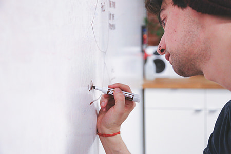 person holding black permanent marker thumbnail