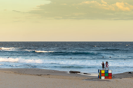 Kids standing on Rubik cube at maroubra beach, Australia thumbnail
