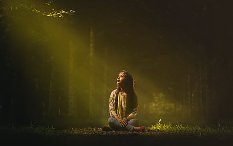 woman wearing yellow long-sleeved top and gray bottoms at golden hour thumbnail