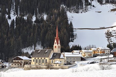 photo of beige cathedral beside trees thumbnail