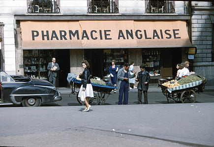 people standing in front of Pharmacie Anglaise thumbnail