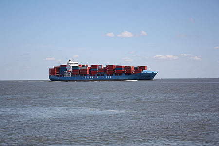 blue transport boat in the middle of sea thumbnail
