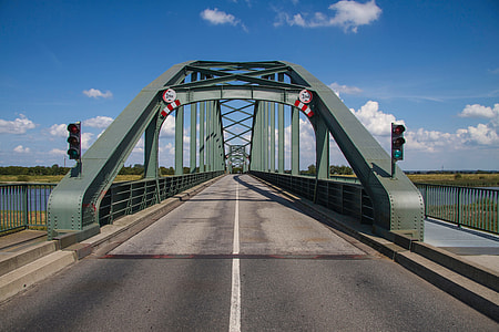 gray concrete bridge under white sky thumbnail