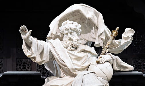 man sitting holding wand statue thumbnail