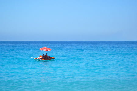 two people on pool float during daytime photography thumbnail