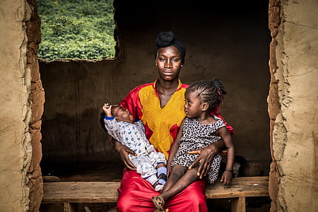 woman carrying two children sitting thumbnail